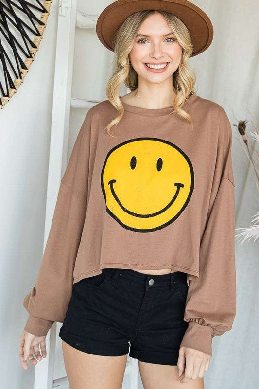 TOP CORTO MANGA LARGA CARA SONRISA