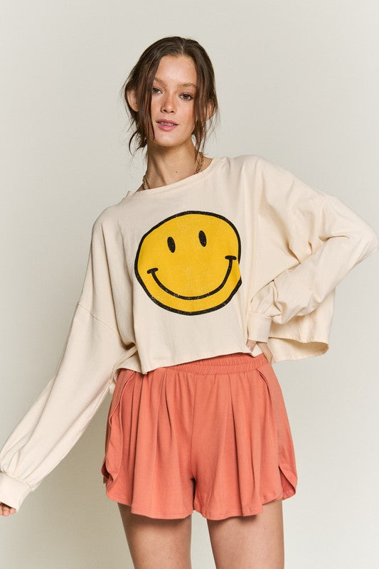 TOP CORTO MANGA LARGA CARA SONRISA